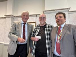 Robert Allan presents the cheque to Bradford Metropolitan Food Bank